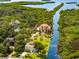 Waterfront property with lush landscaping and private dock at 8731 Betty St, Port Richey, FL 34668
