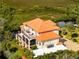 Waterfront property showcasing a large home with expansive deck at 8731 Betty St, Port Richey, FL 34668