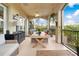 Outdoor balcony with seating and a view of lush greenery at 8731 Betty St, Port Richey, FL 34668