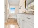 Bathroom boasts a luxurious soaking tub and double vanity at 8731 Betty St, Port Richey, FL 34668