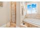 Relaxing bathroom with soaking tub and shower at 8731 Betty St, Port Richey, FL 34668