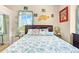 Guest bedroom with a queen-size bed and decorative pillows at 8731 Betty St, Port Richey, FL 34668