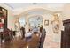 Spacious dining room with large table and views to the living room at 8731 Betty St, Port Richey, FL 34668