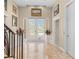 Elegant entryway with tile floors, double doors, and artwork at 8731 Betty St, Port Richey, FL 34668