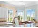 Bright kitchen with granite countertops and white cabinets at 8731 Betty St, Port Richey, FL 34668