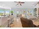 Open living room with access to a balcony and kitchen at 8731 Betty St, Port Richey, FL 34668