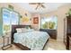 Spacious main bedroom with large windows and dresser at 8731 Betty St, Port Richey, FL 34668