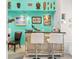 Stylish wet bar with turquoise walls and unique artwork at 8731 Betty St, Port Richey, FL 34668