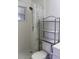 Clean bathroom with shower, toilet and shelving unit at 9705 45Th N Way, Pinellas Park, FL 33782