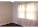 Bedroom with wood floors and sheer curtains at 9705 45Th N Way, Pinellas Park, FL 33782