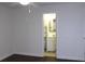 Bedroom with view of bathroom and wood floors at 9705 45Th N Way, Pinellas Park, FL 33782