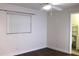 Bedroom with bathroom access and wood floors at 9705 45Th N Way, Pinellas Park, FL 33782
