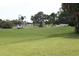 Golf course with players visible at 9705 45Th N Way, Pinellas Park, FL 33782