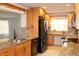 Updated kitchen with granite countertops, modern appliances, and wood cabinets at 9705 45Th N Way, Pinellas Park, FL 33782