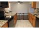 Open concept kitchen with breakfast bar and hardwood floors at 9705 45Th N Way, Pinellas Park, FL 33782
