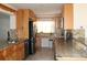 Modern kitchen featuring granite countertops and stainless steel appliances at 9705 45Th N Way, Pinellas Park, FL 33782