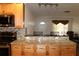 Kitchen boasts granite countertops and light wood cabinets at 9705 45Th N Way, Pinellas Park, FL 33782