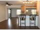 Eat-in kitchen with light wood cabinets, granite countertops, and breakfast bar at 9705 45Th N Way, Pinellas Park, FL 33782