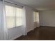 Bright living room featuring hardwood floors and large windows at 9705 45Th N Way, Pinellas Park, FL 33782