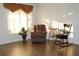 Living room with hardwood floors,recliner, rocking chair, and window at 9705 45Th N Way, Pinellas Park, FL 33782