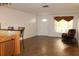Living room with hardwood floors, recliner, rocking chair, and window at 9705 45Th N Way, Pinellas Park, FL 33782