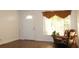 Living room with hardwood floors,recliner, rocking chair, and window at 9705 45Th N Way, Pinellas Park, FL 33782