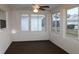 Bright sunroom with multiple windows and a ceiling fan at 9705 45Th N Way, Pinellas Park, FL 33782