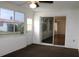 Sunroom with ceiling fan, carpet, and sliding glass doors at 9705 45Th N Way, Pinellas Park, FL 33782