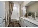 Clean bathroom with double vanity and a bathtub at 10237 Fieldstone Myrtle Way, San Antonio, FL 33576