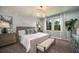 Spacious bedroom with large windows, plush carpet, and stylish furniture at 10237 Fieldstone Myrtle Way, San Antonio, FL 33576