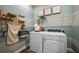 Convenient laundry room with washer, dryer, and ample storage at 10237 Fieldstone Myrtle Way, San Antonio, FL 33576