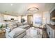 Spacious living room with sectional sofa and large TV at 10237 Fieldstone Myrtle Way, San Antonio, FL 33576