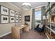 Bright and airy home office with built-in shelving and a large desk at 10237 Fieldstone Myrtle Way, San Antonio, FL 33576