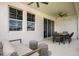 Covered patio with seating area and outdoor dining set at 10237 Fieldstone Myrtle Way, San Antonio, FL 33576