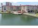 Aerial view of condo building, pool, and marina at 105 Island Way # 146, Clearwater, FL 33767