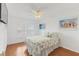 Guest bedroom with coastal decor and hardwood floors at 105 Island Way # 146, Clearwater, FL 33767