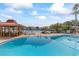 Relaxing community pool with patio furniture at 105 Island Way # 146, Clearwater, FL 33767