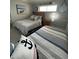 Guest bedroom with a full-size bed and twin bed at 1270 Gulf Blvd # 1206, Clearwater Beach, FL 33767