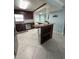 Kitchen with granite countertops and a wine rack at 1270 Gulf Blvd # 1206, Clearwater Beach, FL 33767