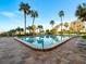 Inviting community pool with lounge chairs at 1270 Gulf Blvd # 1206, Clearwater Beach, FL 33767