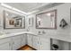 Bathroom with double vanity and large mirrors at 13101 Delbarton St, Spring Hill, FL 34609