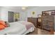 Bedroom with pool view, double bed, and dresser at 13101 Delbarton St, Spring Hill, FL 34609