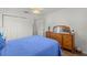 Bright bedroom with double bed, dresser, and ample closet space at 13101 Delbarton St, Spring Hill, FL 34609