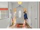 Bright entryway with wood floors and coat rack at 13101 Delbarton St, Spring Hill, FL 34609