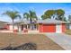 Single-story home with attached garage and palm trees at 13101 Delbarton St, Spring Hill, FL 34609