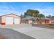 Property featuring a house and a large detached garage at 13101 Delbarton St, Spring Hill, FL 34609