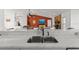 Kitchen with double sink and view of living room at 13101 Delbarton St, Spring Hill, FL 34609