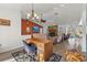 Spacious living room with fireplace and view to kitchen at 13101 Delbarton St, Spring Hill, FL 34609