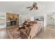 Living room with stone fireplace and hardwood floors at 13101 Delbarton St, Spring Hill, FL 34609