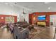 Living area with stone fireplace and wood-look floors at 13101 Delbarton St, Spring Hill, FL 34609